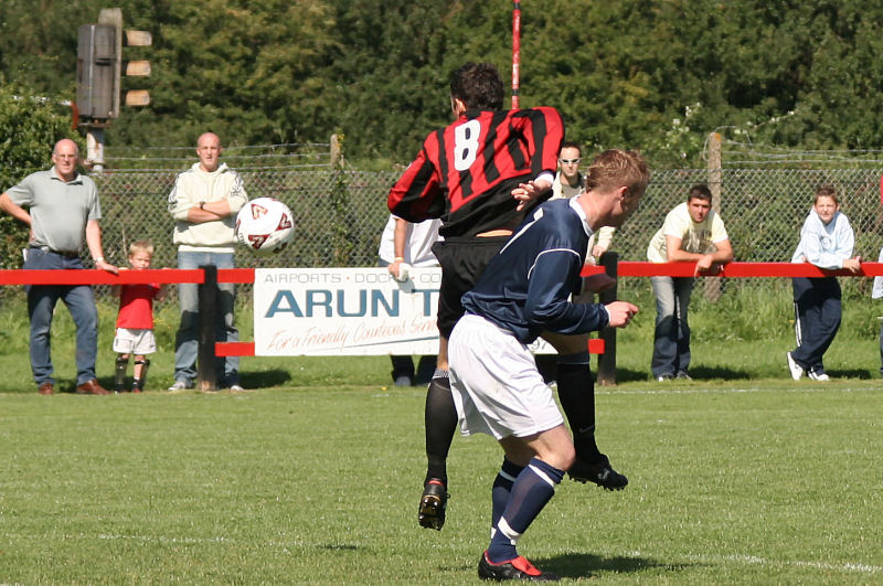 Wick's Marc Cooper (8) battles with Rob Grove (7)
