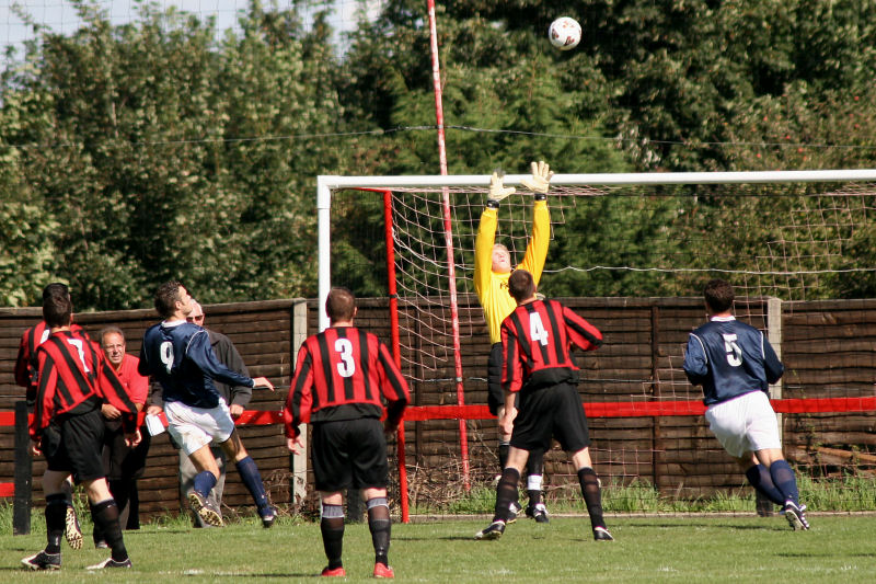 Tom Rand stretches to catch this high cross
