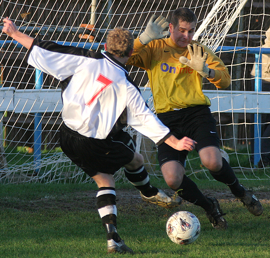 Calum Britton (7) is one on one with the keeper ...
