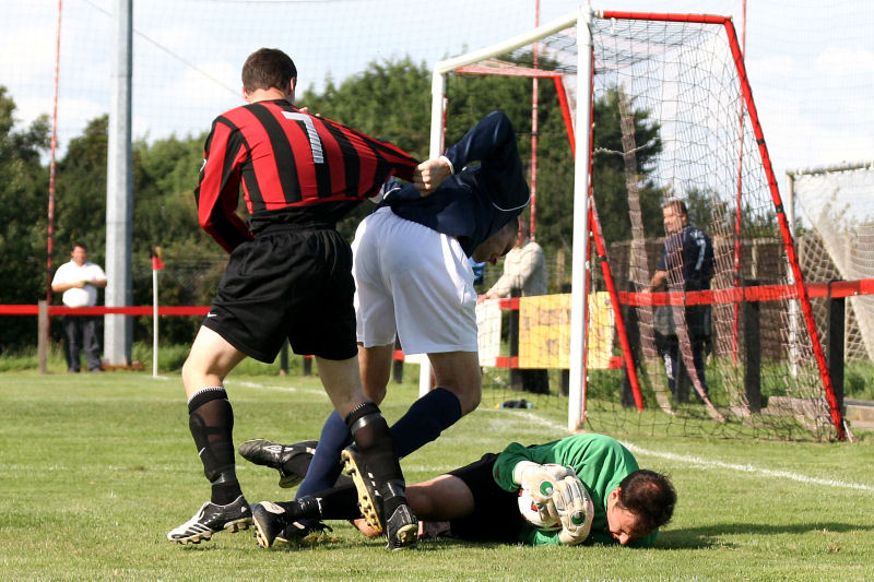 This run by Kieron Howard is stopped by Jim Smith (?) and keeper Ben O'Connor
