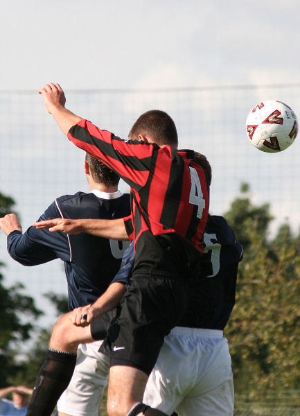 Chris Morrow (4) jumps with Stuart Hack (5) and Jon Tucker (6)
