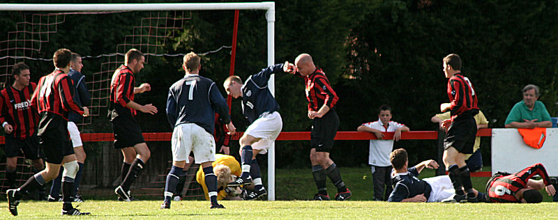 More frantic goalmouth action as Tom Rand gathers at the feet of Lee Barnard
