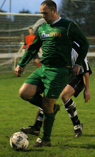 Mark Enticknap beats a defender and crosses to the far post ..
