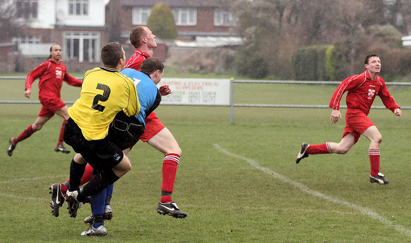 Redhill defence are caught out of position as Phil Turner comes forward
