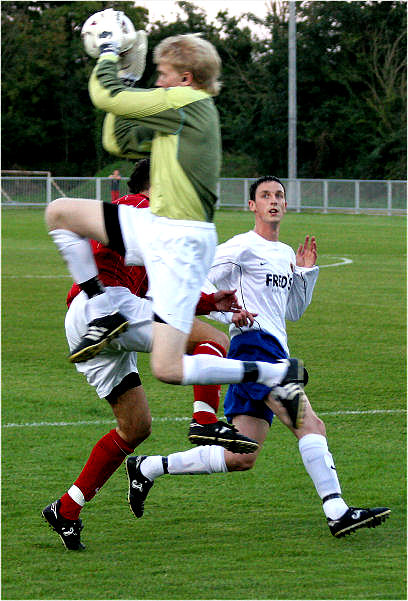 Tom Rand races out to catch the ball
