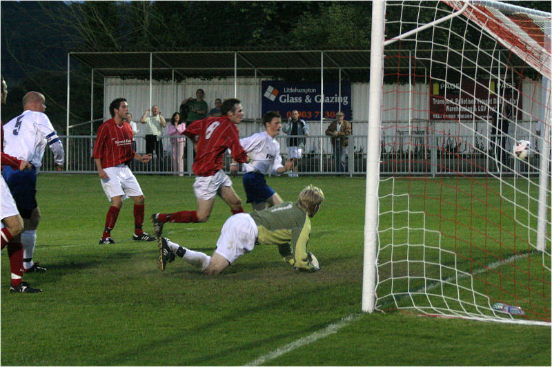 Tom Rand makes a good save on to the post but Andy Boxall is quickest to the rebound and puts Arundel one up
