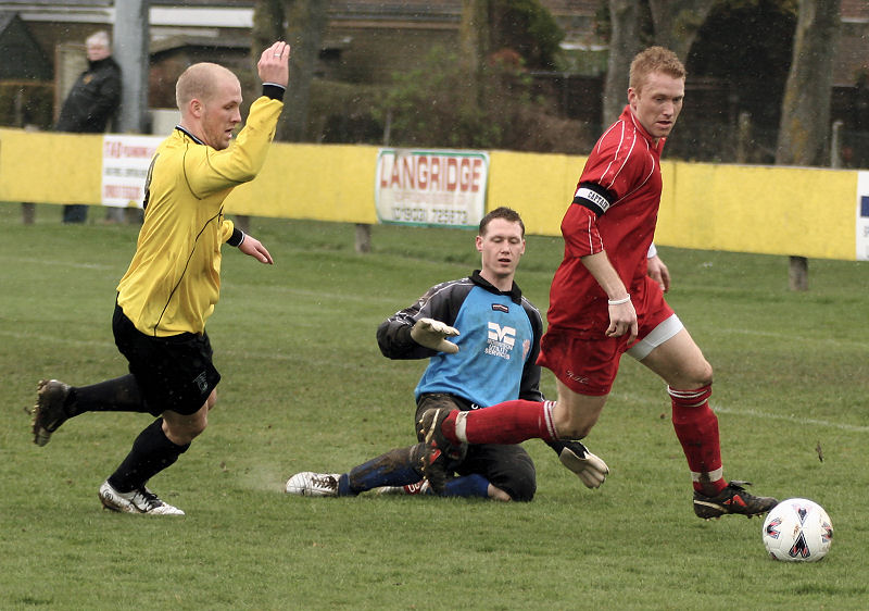 Stuart Channon clears the ball with Steve Davies coming in 
