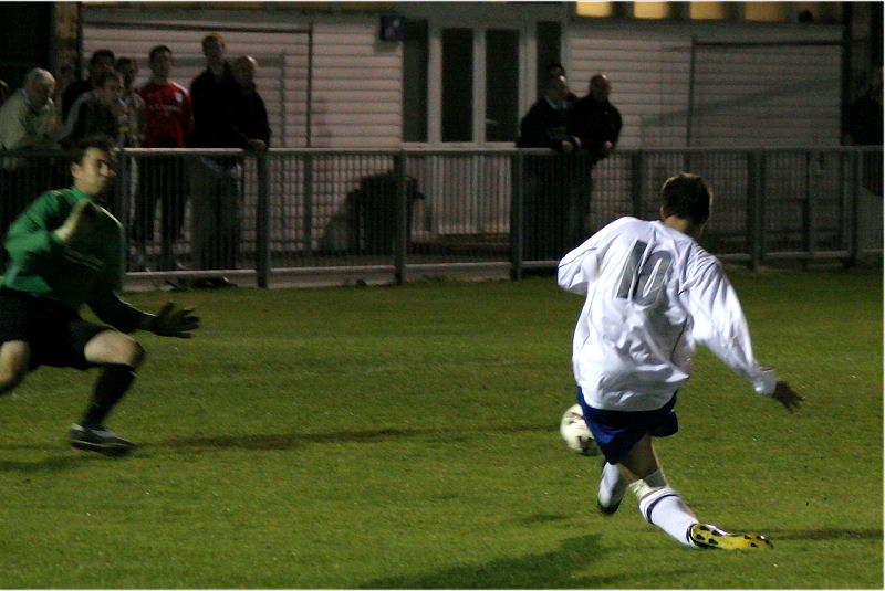Tom Manton curls the ball round Ben O'Connor...

