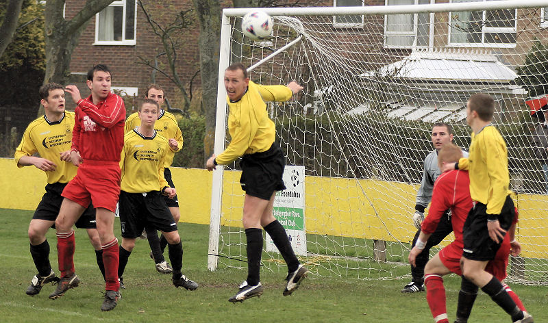 Gary Young heads away a Redhill attempt
