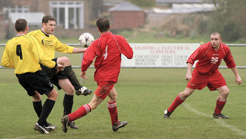 Barry Pidgeon hooks the ball away from Ben Biggar
