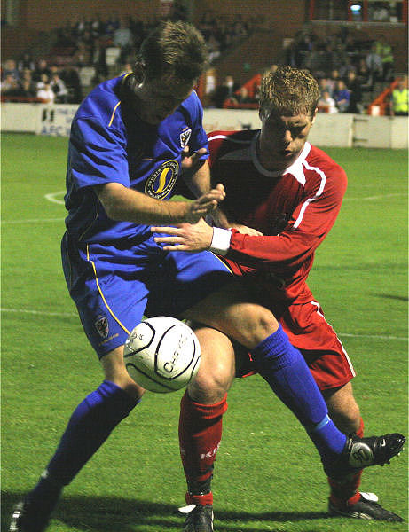 Shane Smeltz is tackled by Mark Willy
