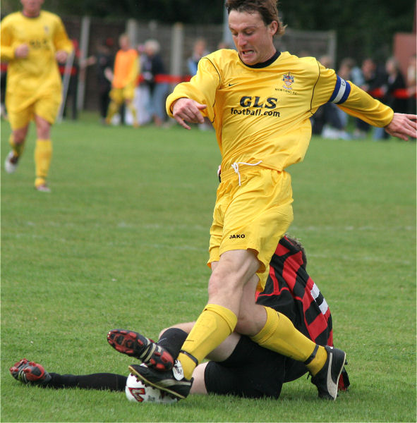 Marc Cable tries to get the ball from Danny Curd
