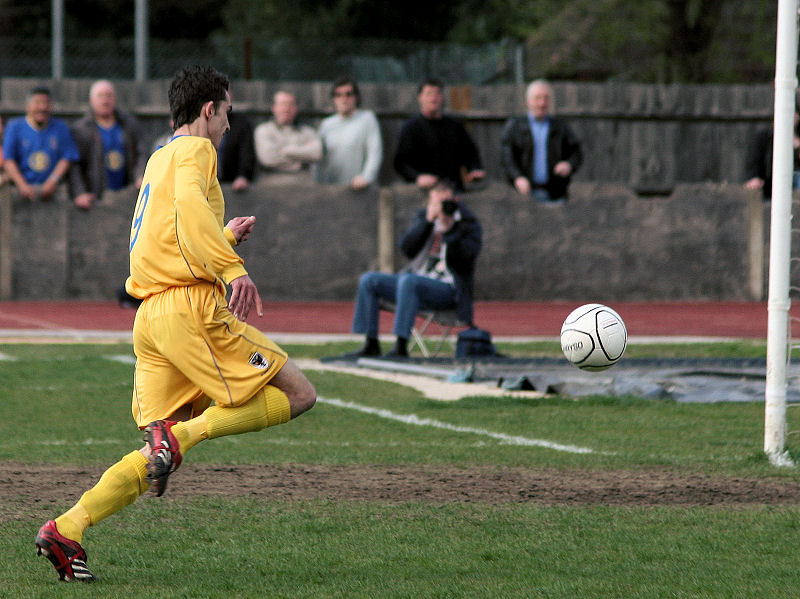 Paul Barnes chases the ball past the keeper ...
