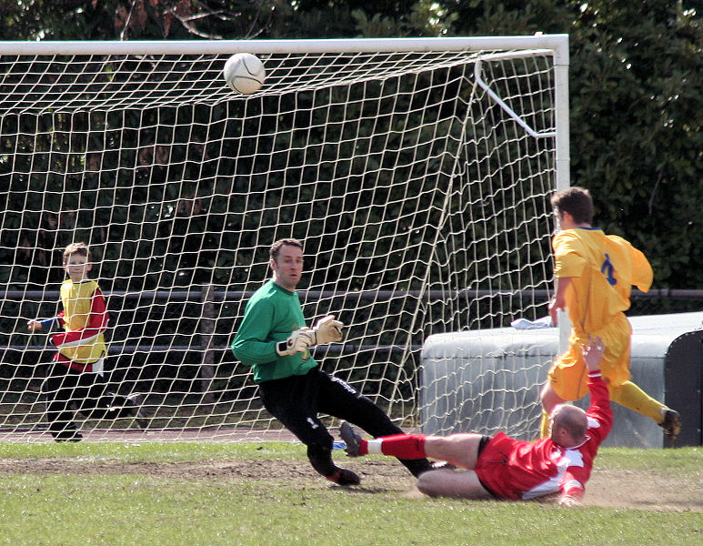 Andy Little races out to block
