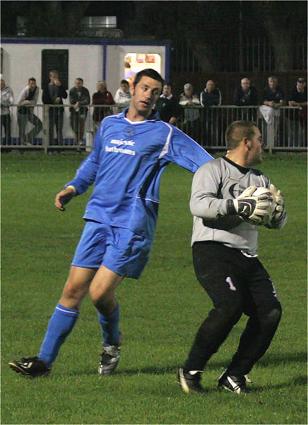 Wes Hallett grabs the ball ahead of Martin O'Donnell
