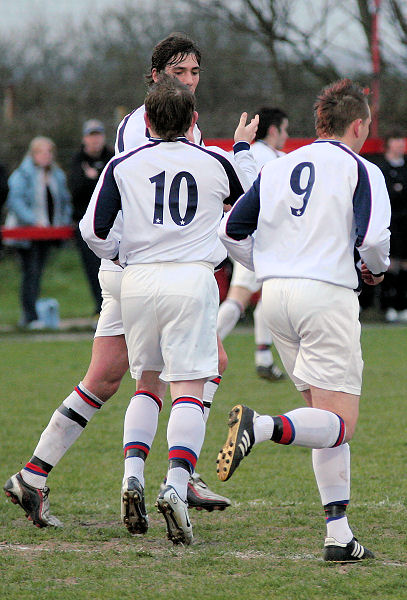 Jan Miller opens the scoring and is congratulated by Liam O'Brien and Simon Corona
