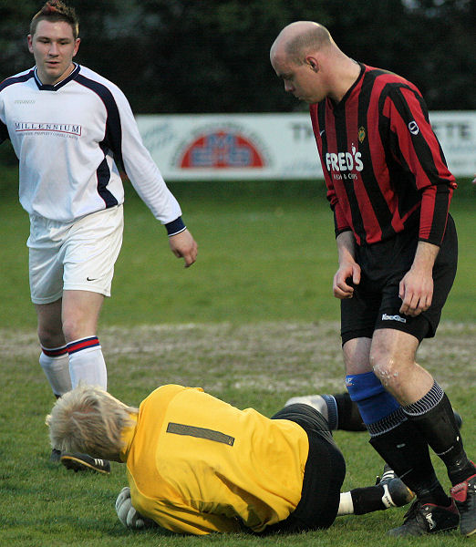 ... and Tom drops to the ground safely holding the ball
