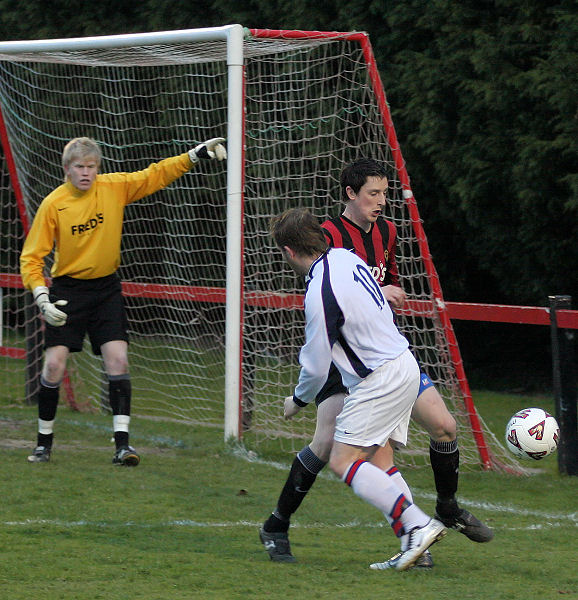 Dave Sharman nicks the ball away from Jan Miller
