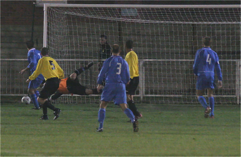 Ronan Callaghan turns this late Littlehampton shot round the post
