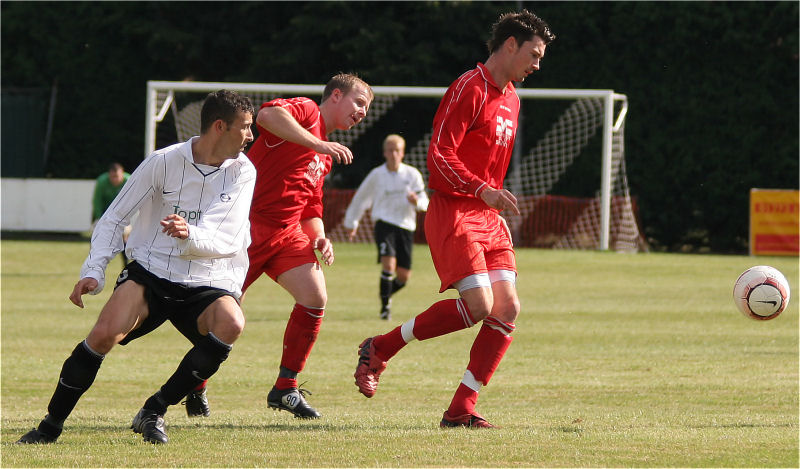 Stuart Channon gets the ball away from Phil Churchill
