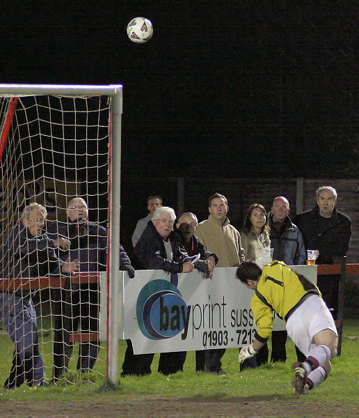 Marc Cooper's great free kick to the top right corner is tipped over by Sam Figg
