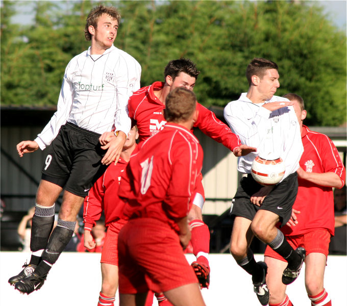 Josh Biggs gets a header in
