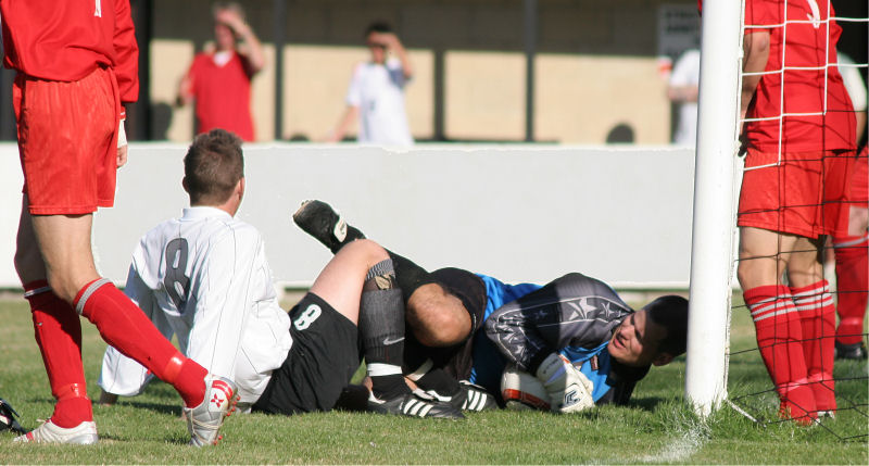 Chris Roberts makes a vital save from James Bennett
