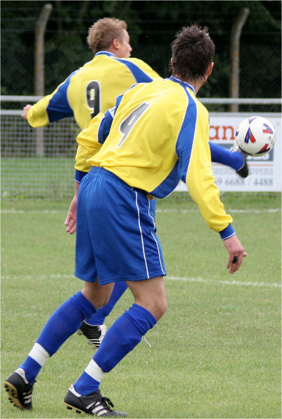 Hat trick man Steve Dallaway (9) brings the ball down watched by Adam Davidson
