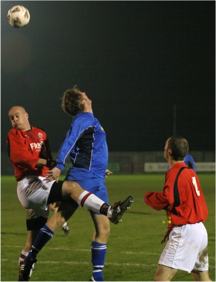Tony Miles and Jay Head compete for a header
