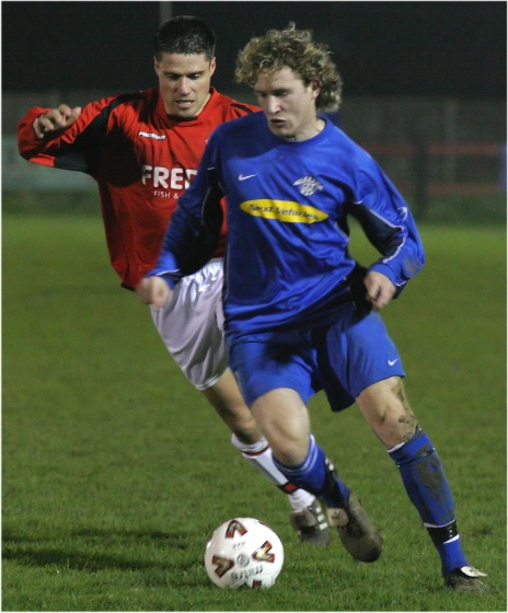 Roy Pook closely watched by Paul Williams
