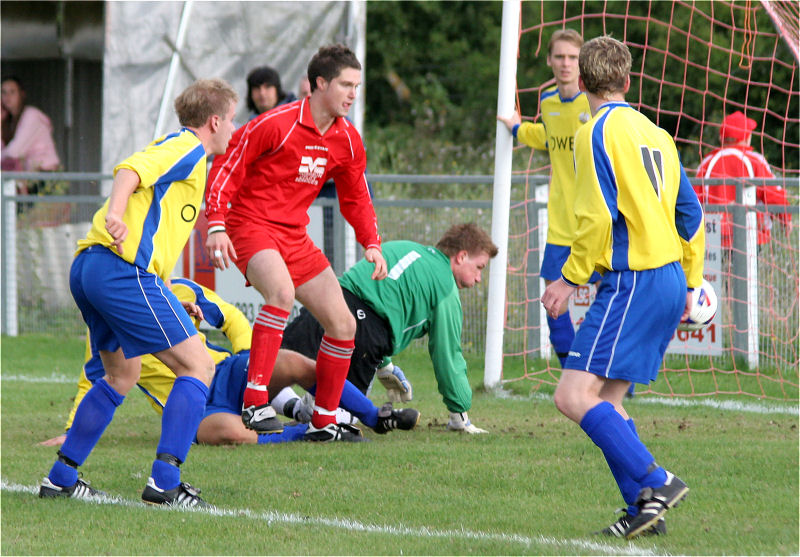 Keeper Phillip Bowald is relieved as this Redhill effort goes right across the goalmouth
