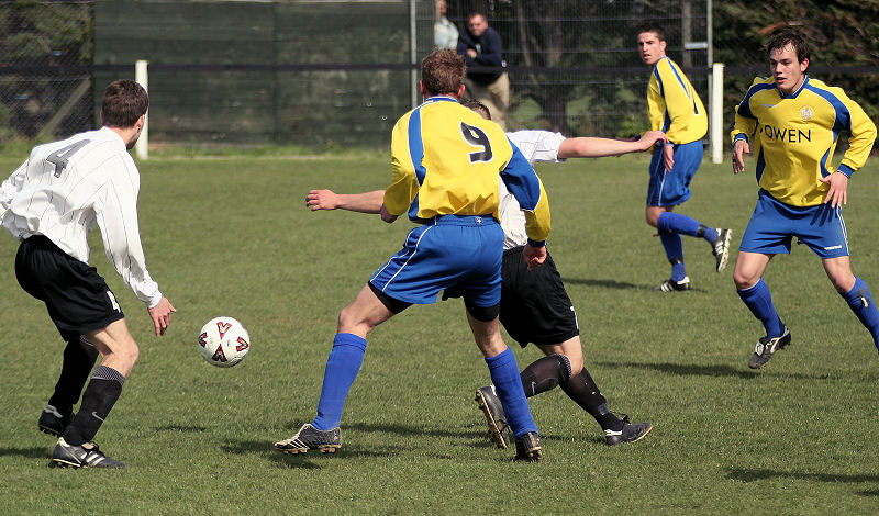 Seb Keet flicks the ball past Steve Dallaway
