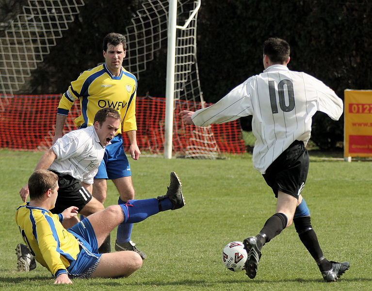 Sonny Banks avoids a tackle by John Piercy with Ryan Hudson and Darren Smith close by
