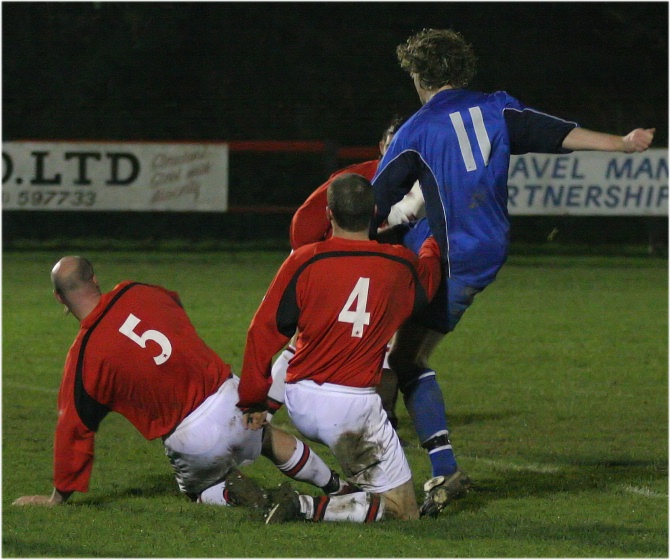 Tony Miles and Mark McCallum stop Roy Pook
