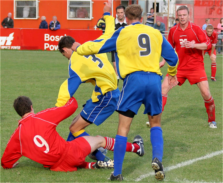 Chad Heuston (9) and Ben Billings (3) tussle for the ball watched by Steve Dallaway (9) and Geoff Clark
