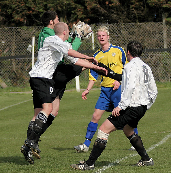 Greg Nessling intercepts under pressure from Josh Biggs
