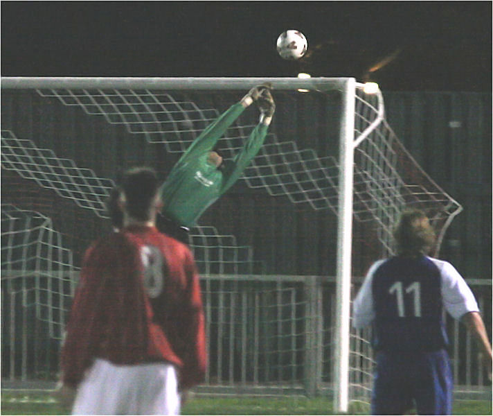 The ball is heading for the top right corner but Ben O'Connor makes a great save
