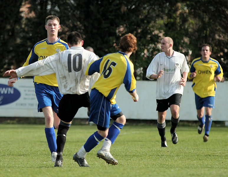 Sonny Banks brings the ball down with Callum Legate looking to challenge
