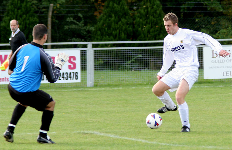 Danny Curd is one on one with Chris Roberts who saved with his feet
