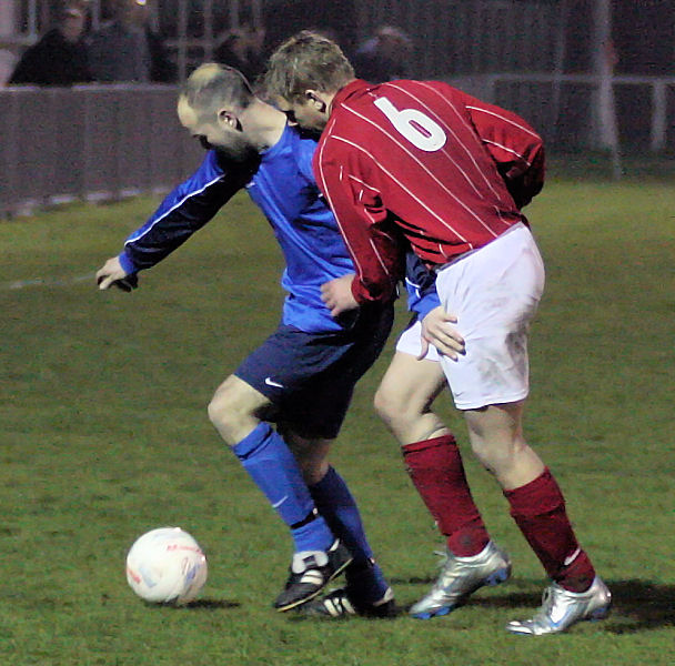 Darren Annis shields the ball from Duncan Barnes
