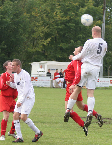 A typical Tony Miles header as he outjumps Paul Whithread
