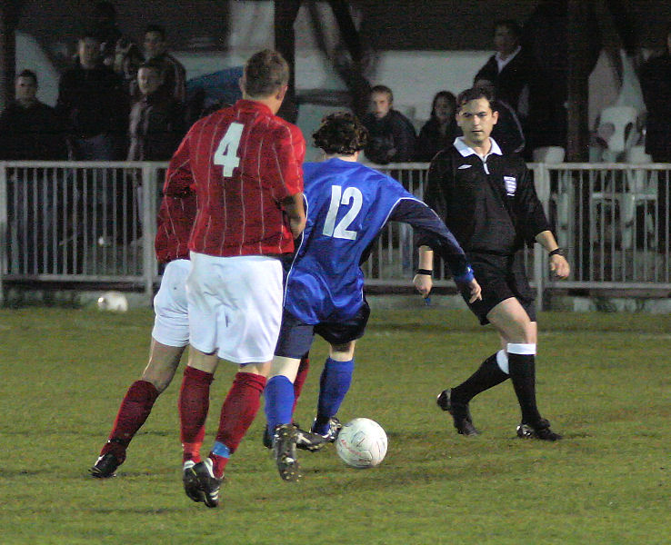 Kieron Howard on the ball avoids Lloyd Walker
