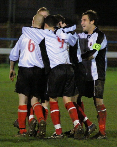 Pagham players surround Callum Britton after his spectacular goal
