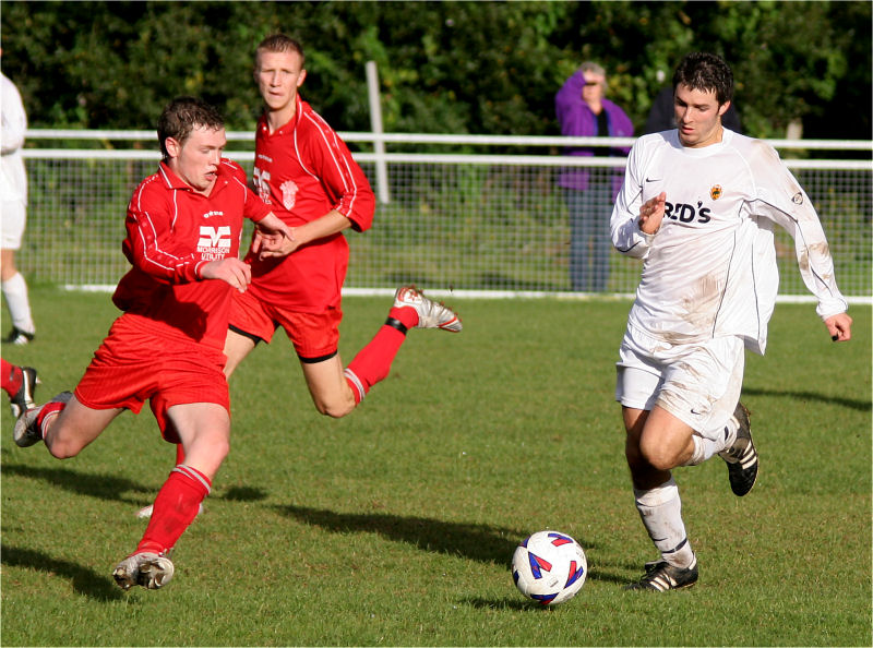 Ali Bance about to tackle Tom Manton
