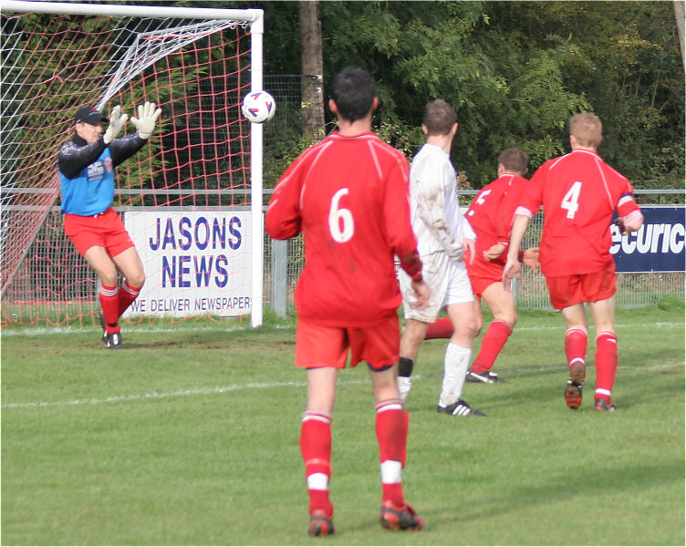 Sub Keeper Matt Dean pushes this shot over the bar ...
