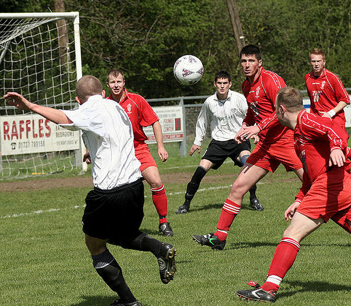 Josh Biggs gets into the area and the Redhill defence arrive in force
