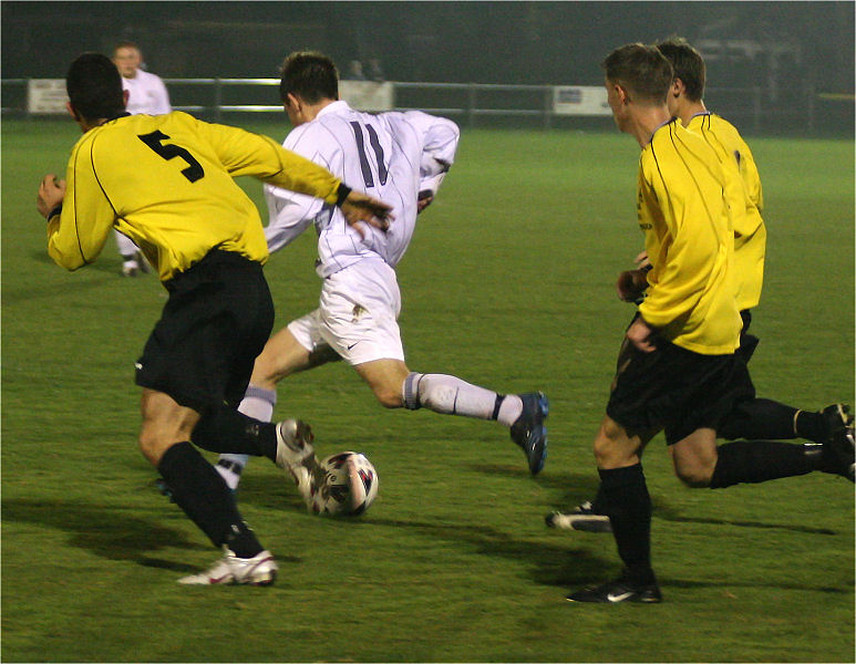 Matt Axell (11) runs into the box with Derek Chester (5) 
