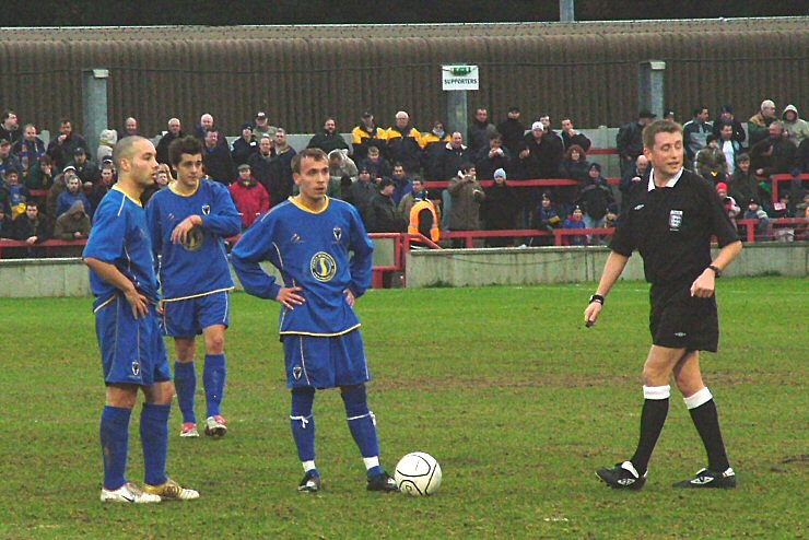 Ryan Gray, Steve Gibson and Gary Prigent work out the free kick
