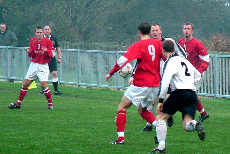 Gary Norgate(9) attacks the ball chased by Oliver West (2)
