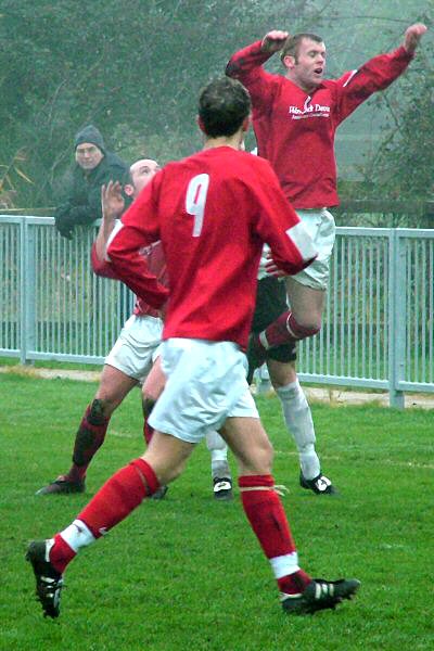 Rob Grove heads the ball away 
